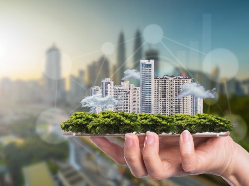 Smart cities miniature placed on a human hand