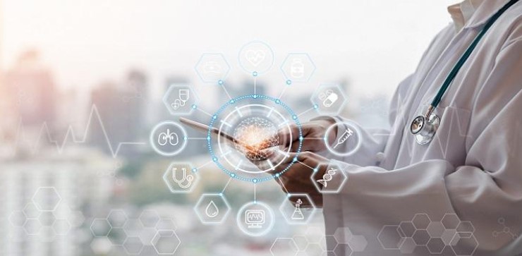 Figure 2 – An image of a physician and the possible functions and signs he can monitor from a portable electronic device (How AI Helps Physicians Improve Telehealth Patient Care in Real-Time | telemedicine.arizona.edu).