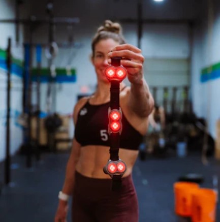 Crossfit Games Athlete, Emily Rolfe holding Kineon MOVE+ Pro | Source: Kineon